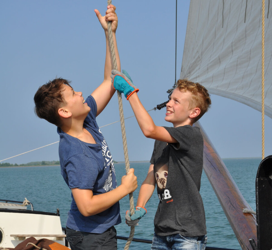 Family sailing on the IJsselmeer by