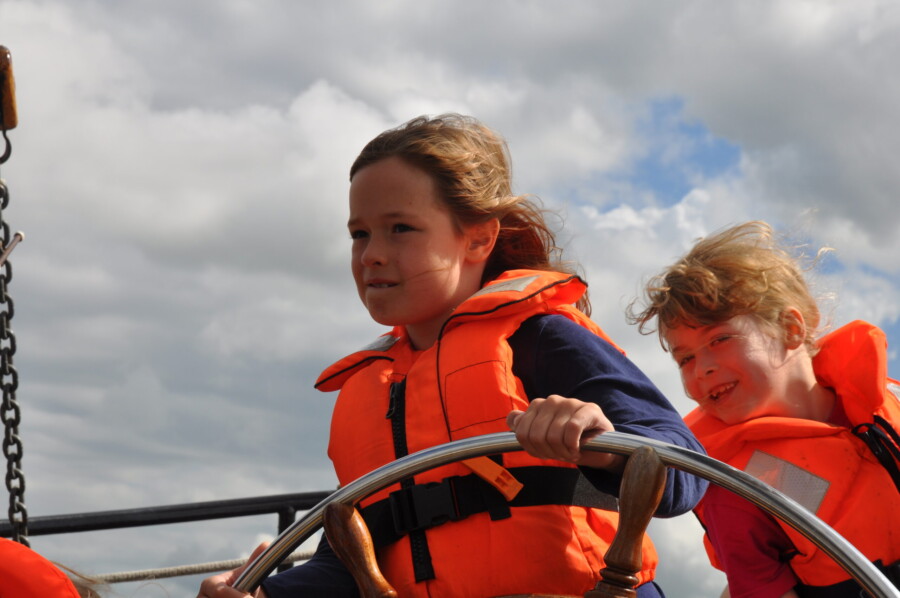 Family sailing on the IJsselmeer by