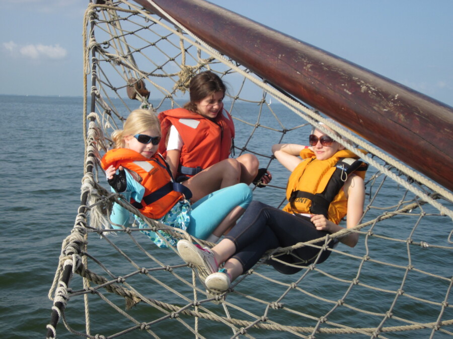 Family sailing on the IJsselmeer by