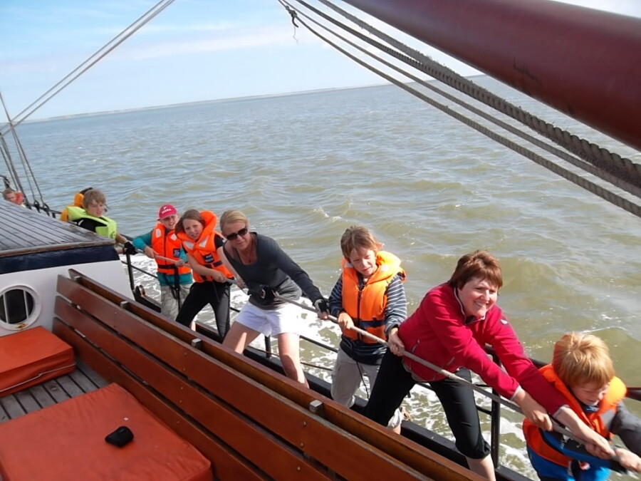 Family sailing on the IJsselmeer by