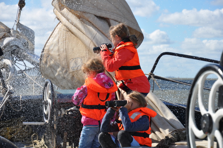 Family sailing on the IJsselmeer by