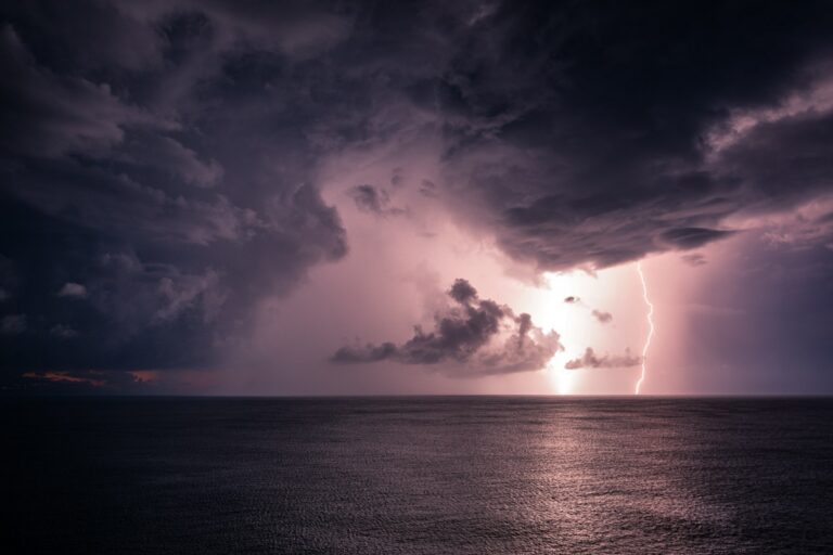 Thunderclouds with lightning over the sea