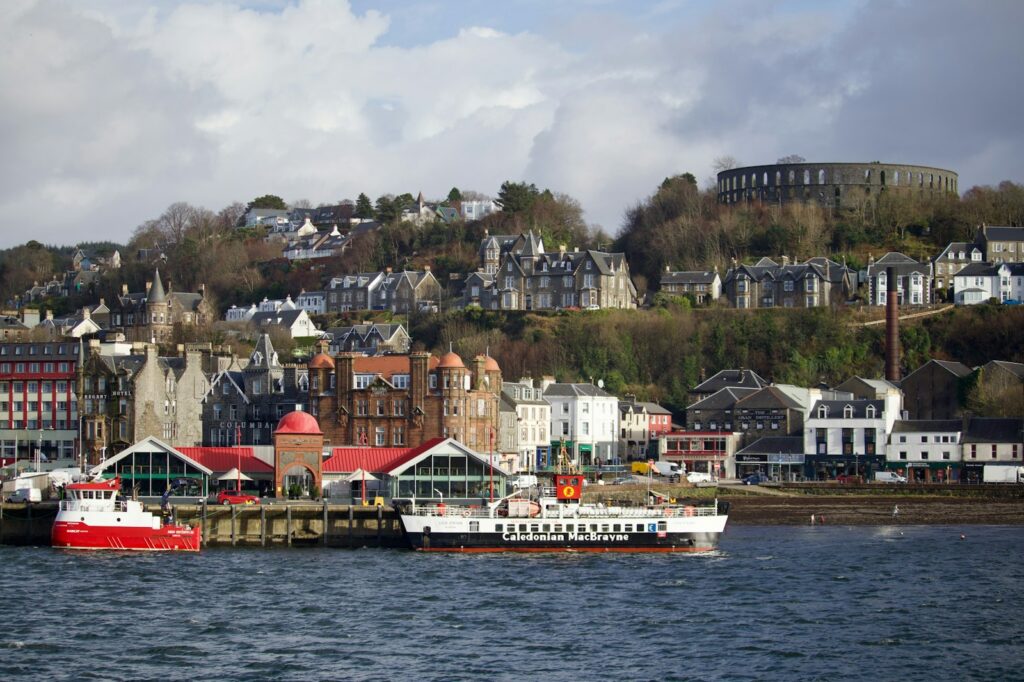 Oban waterfront with McCaig's Tower on the hill