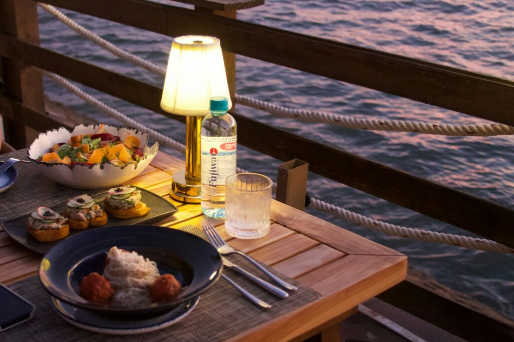 Table laid on board at dusk