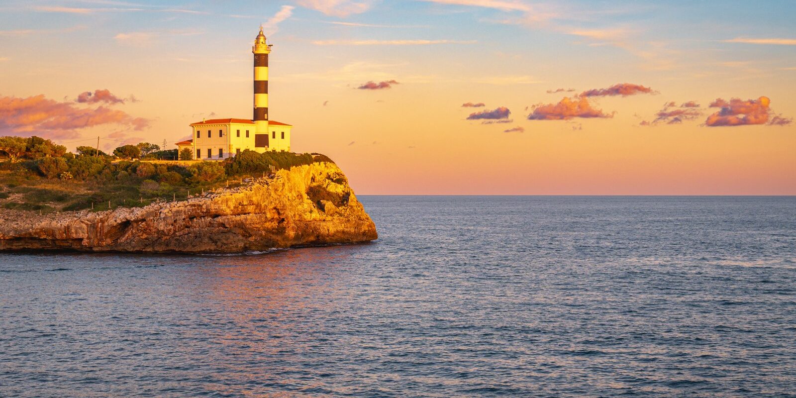 Portocolom lighthouse at sunset Portocolom lighthouse at sunset